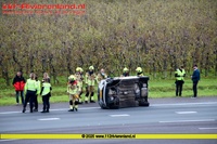Enspijk - Auto op de zijkant geen gewonden 